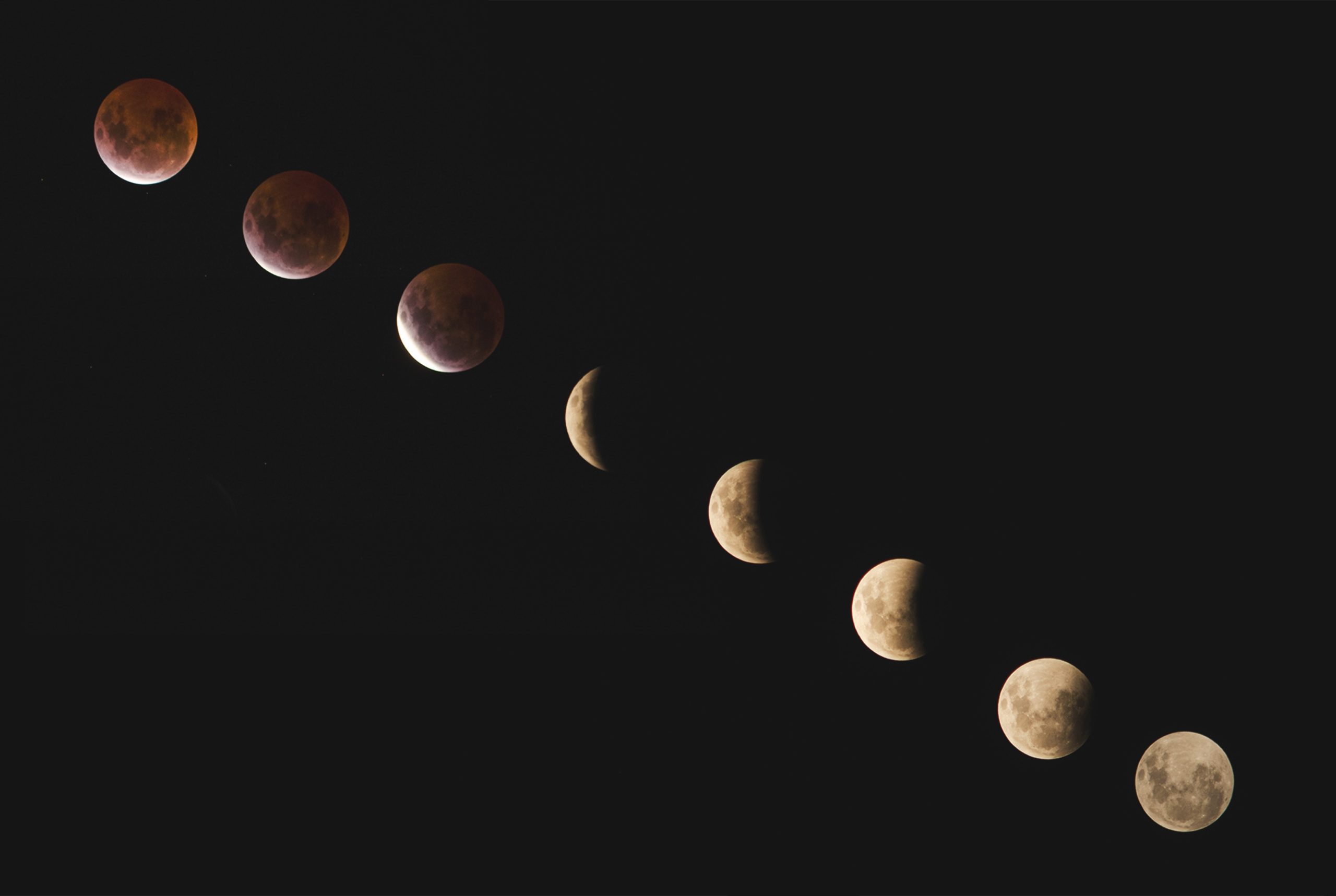 The various moon phases shown in the night sky