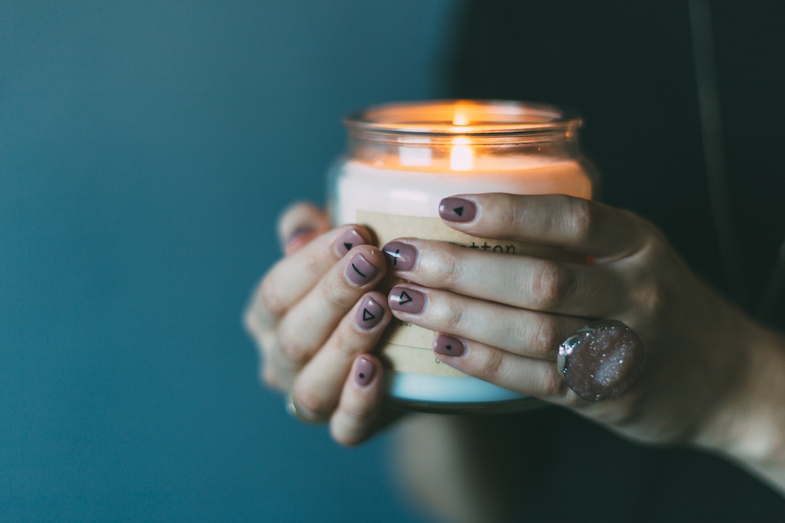 A woman holding a candle